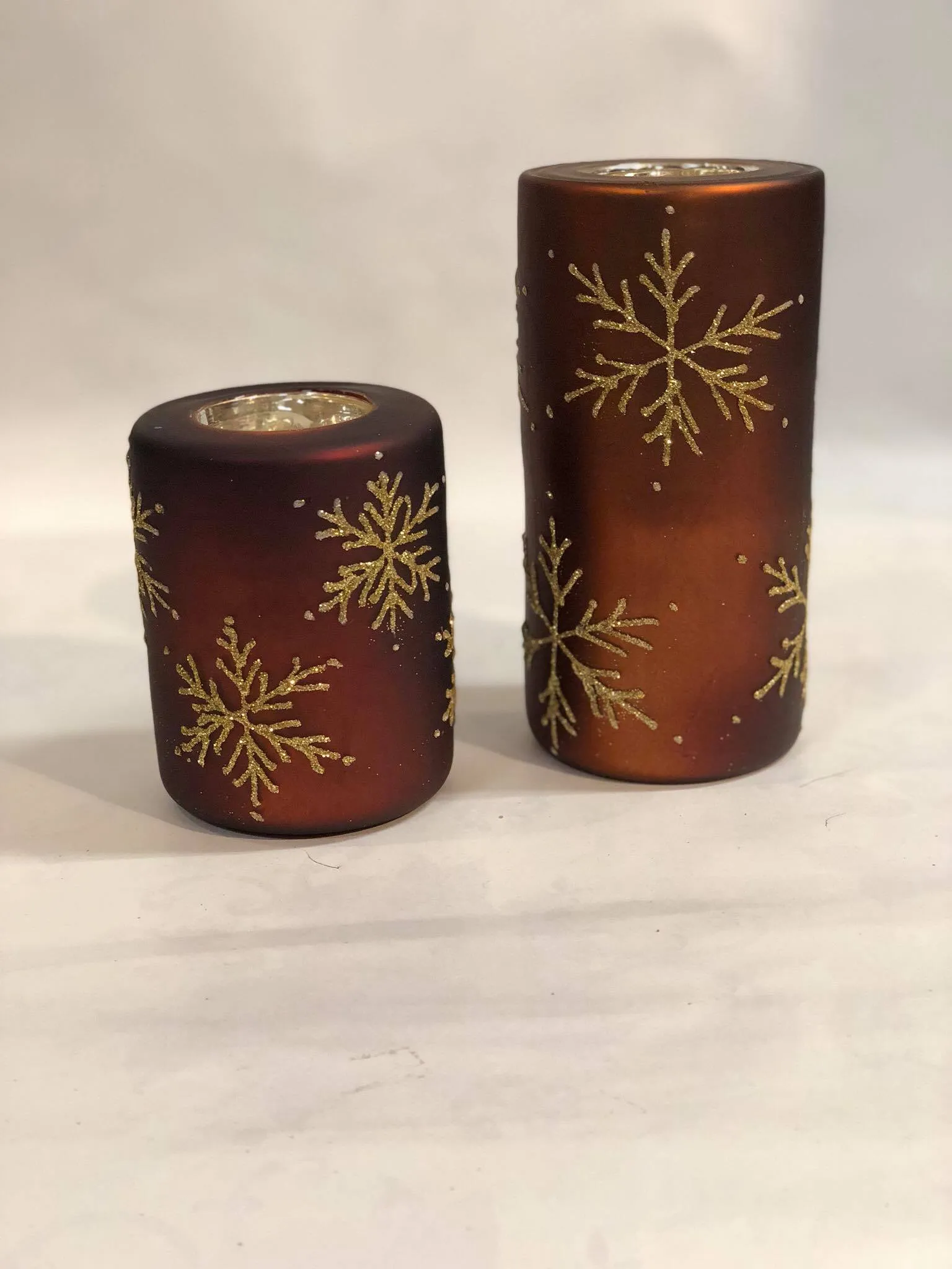 Brown tea light candle holder with gold snowflakes