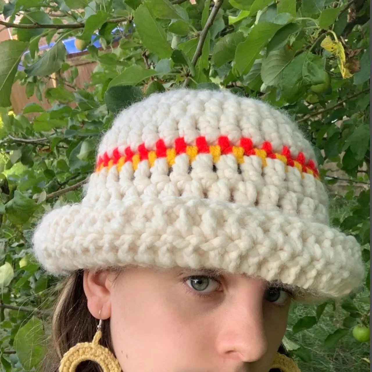 Handmade cream chunky bowler hat with red and yellow stripes