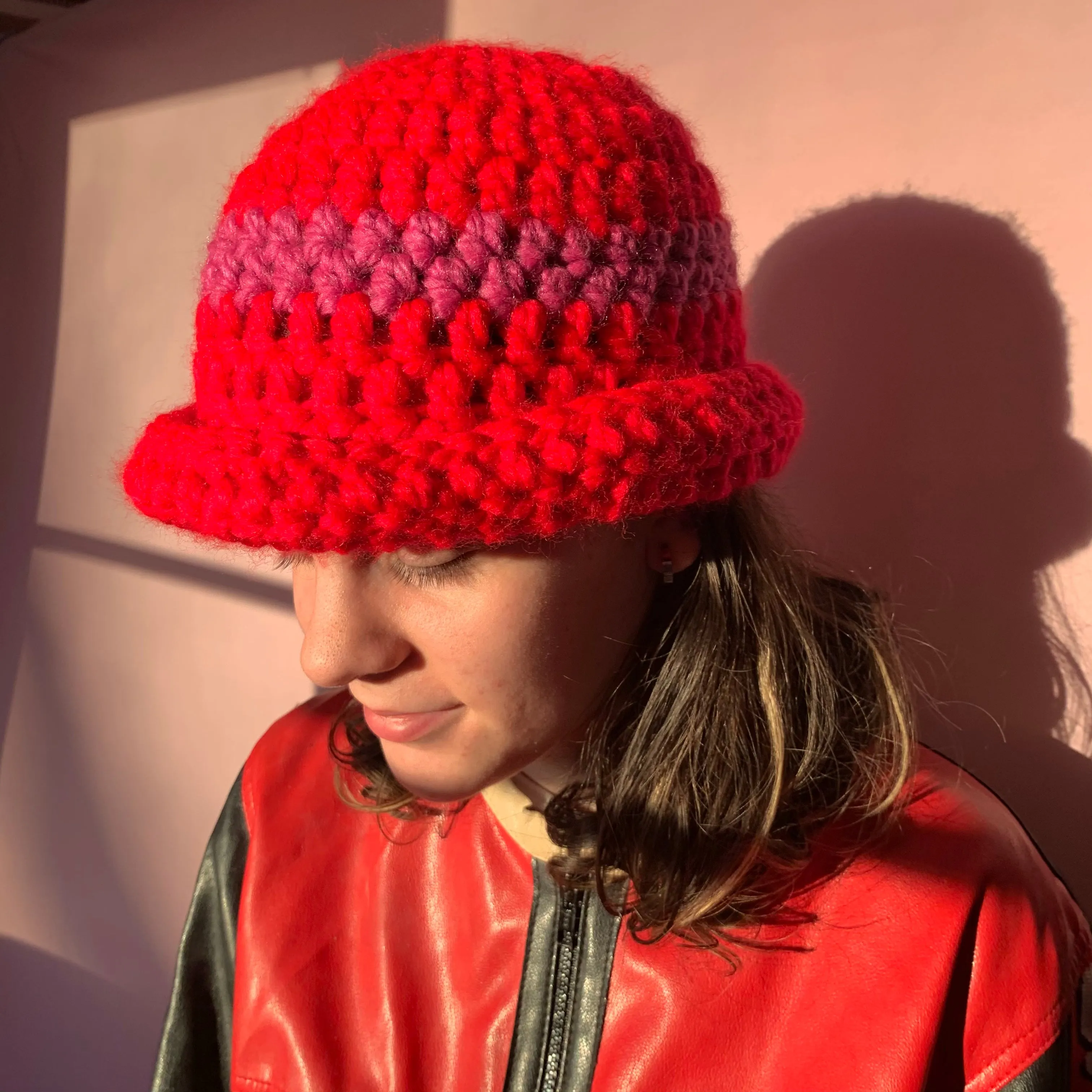 Handmade scarlet red chunky crochet bowler hat with fuschia pink stripe