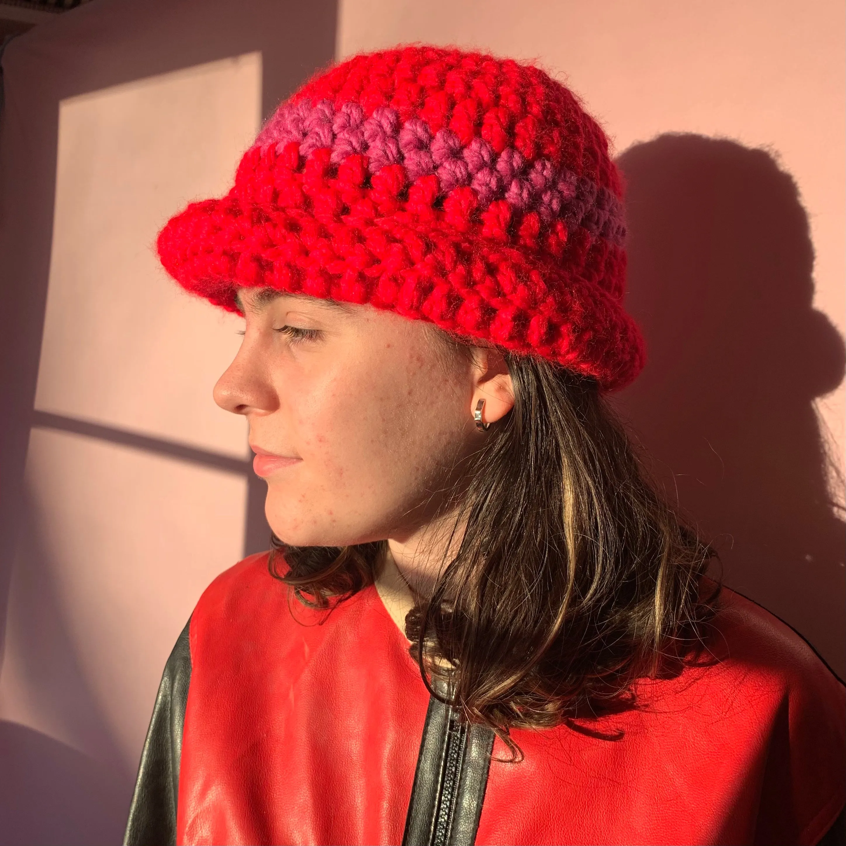 Handmade scarlet red chunky crochet bowler hat with fuschia pink stripe